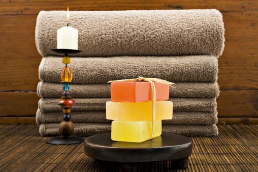 Soap candles and towels in a spa - shallow depth of field