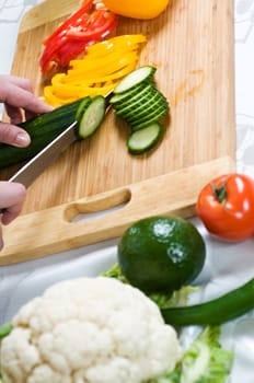 Cutting of vegetables on a chopping board