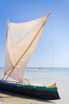 Malagasy outrigger pirogue with makeshift sails