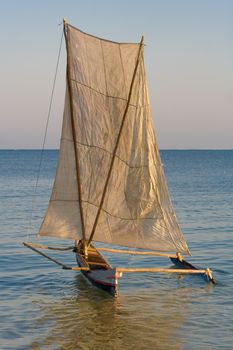Malagasy outrigger pirogue with makeshift sails