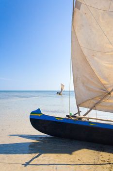 Malagasy outrigger pirogue with makeshift sails