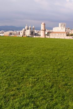 Medieval Fortress and cathedral front lawn in Marseille France