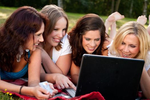 Girlfriends are having fun in the park