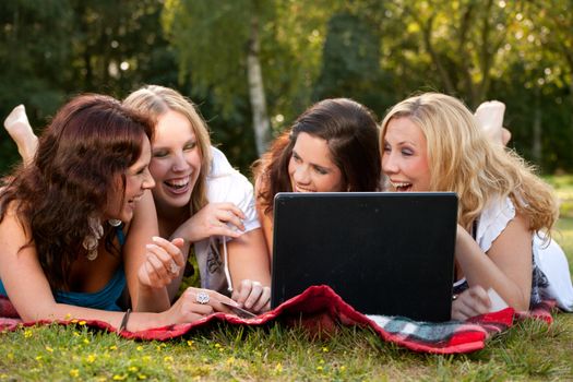 Girlfriends are having fun in the park