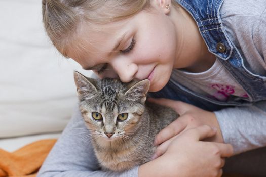 portrait of child with kitten