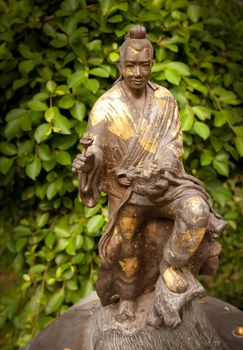 Bronze statue of Kuan Yin surrounding at the munoment, Korat, Thailand.