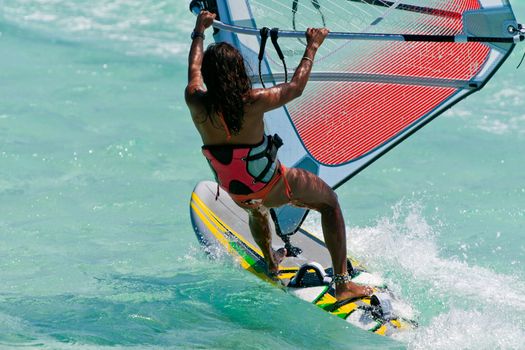 Woman windsurfing in the lagoon