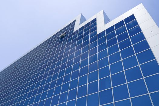 Perspective shot of business tower. Blue windows. High tech building in Antananarivo, Madagascar