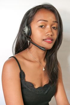 Beautiful young woman operator talking into a  headset