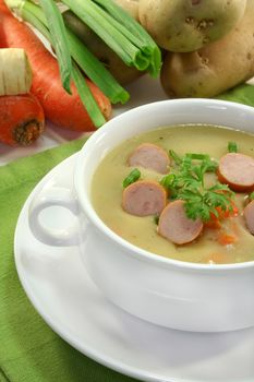 Cream of potato soup with vegetables and Vienna sausages
