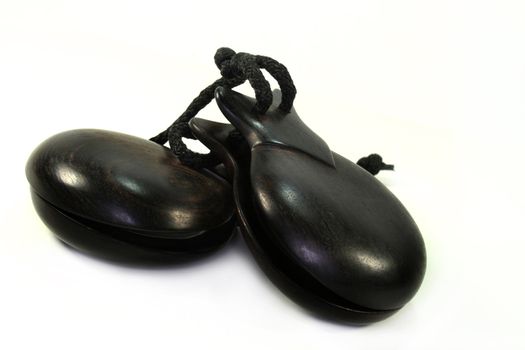 two castanets on a white background