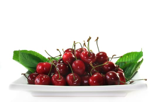 fresh red cherries on a white background