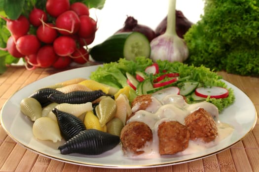 Swedish meatballs with noodles and radish-cucumber salad