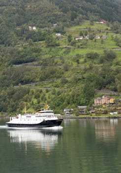 Ferry boat passing the eagleroad and Grande, Geirangerfjorden, Norway