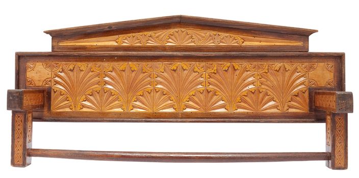 Old carved wooden ktichen towel rack with woodworm holes