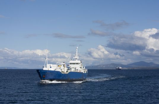 Fishing boat and passenger boat at the Norwegian coast