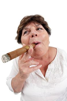 Photo of a woman in her sixties happily smoking a large cuban cigar. Taken with a fisheye lens.