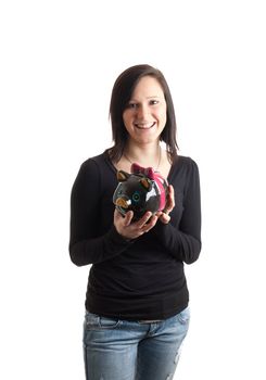 a young woman holding a piggy bank isolated on white