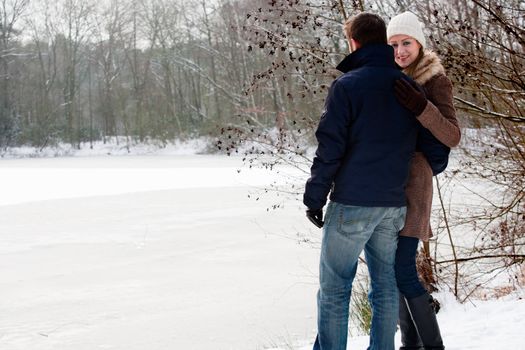 two lovers near a frozen lake