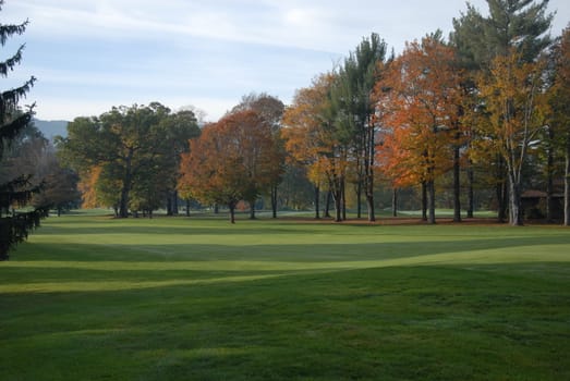 A fairway view on a golf course during the fall
