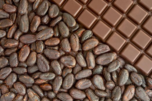 Bar of chocolate, and cocoa beans