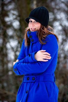 freezing cold girl in blue winter coat