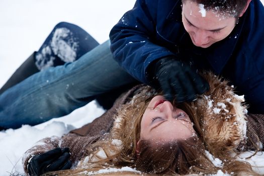 couple being passionate about eachother in winter