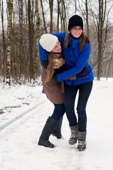 sisters having fun during a winter hike