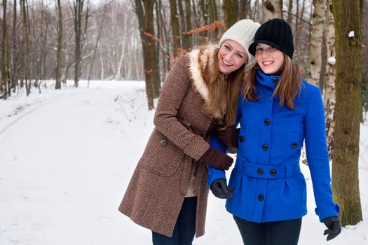 sisters enjoying eachothers company on a winter walk