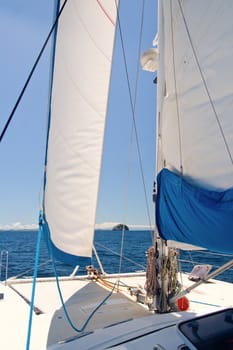 View of islands on the whiite luxury catamaran boat