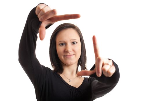 a young woman framing her face with her hands