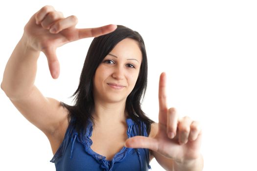 a young woman framing her face with her hands