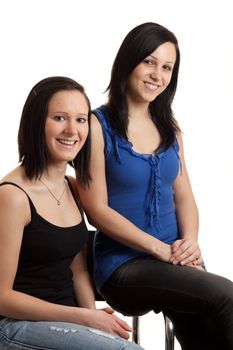 two young women posing isolated on white