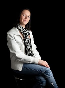 a young woman in casual clothing posing