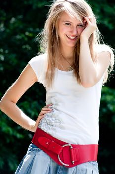 Teenage girl in fresh and happy mood outside in the park