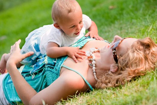 The family and a happy babys first day out in the park