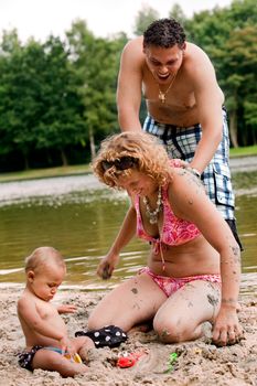 The family and a happy babys first day out in the park