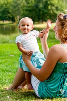 The family and a happy babys first day out in the park