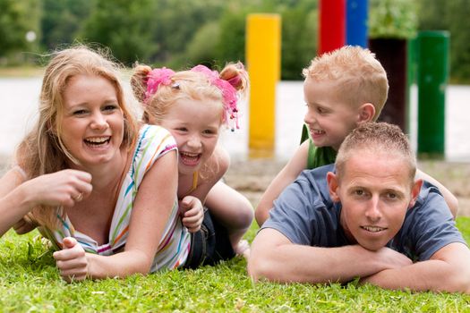 Happy family a day on the beach in the park
