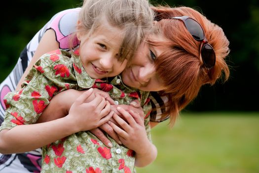 Mother and Daughter are happy in the park