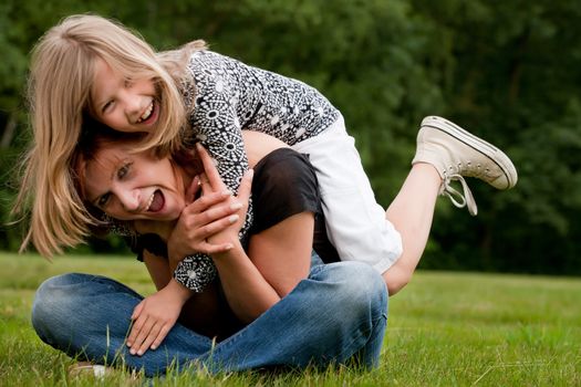 Mother and Daughter are happy in the park