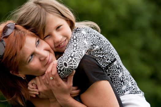 Mother and Daughter are happy in the park