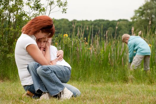 Mother and her kids are happy in the park