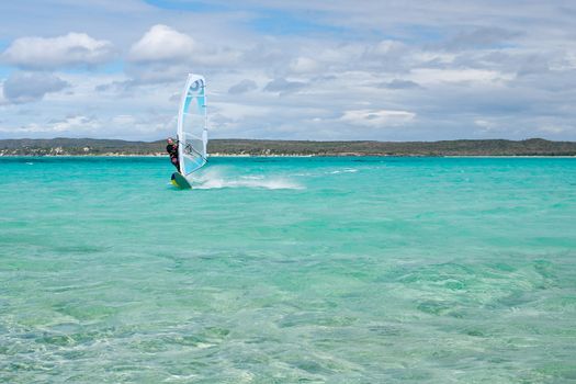 Windsurfer enjoying his sport in the lagoon, Babaomby, Madagascar