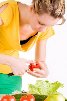 Young girl is making a delicious salad