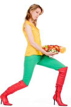 Young girl is posing with a delicious salad