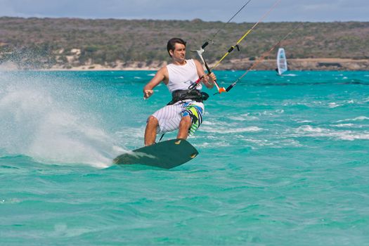 Male kitesurfer enjoying his sport in the lagoon of Babaomby, Madagascar