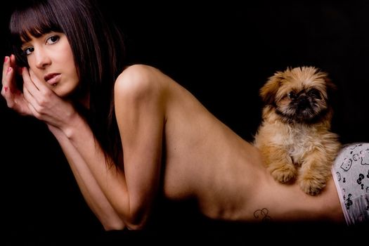 Brunette woman with a cute little pekingese