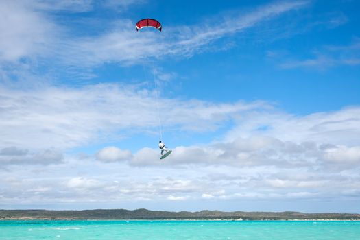 Male kitesurfer jumping in the lagoon of Babaomby, Madagascar