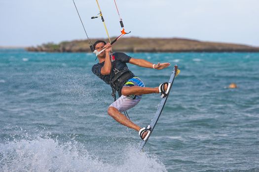 Male kitesurfer kitesurfing in the lagoon of Babaomby, Madagascar